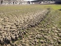 Dry land in a dry reservoir due to global warming Royalty Free Stock Photo