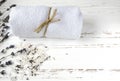 dry lavender flowers with soap, towel and sea salt on vintage wooden table. spa treatments