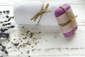 dry lavender flowers with soap, towel and sea salt on vintage wooden table. spa treatments Royalty Free Stock Photo