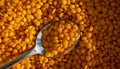 Dry lentils spoon on wooden background