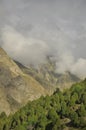 Dry mountain covered with clouds. Combination of dry mountain and green mountain in Darcha