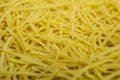 Dry noodles texture, yellow pasta background, small pasta vermicelli or macaroni, Traditional Italian food Royalty Free Stock Photo