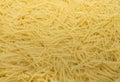 Dry noodles texture, yellow pasta background, small pasta vermicelli or macaroni, Traditional Italian food Royalty Free Stock Photo