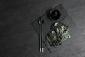 Dry nori sheets, soy sauce and chopsticks on black table, flat lay. Space for text Royalty Free Stock Photo