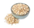 Dry oat flakes in bowl isolated on white Royalty Free Stock Photo