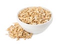 Dry oat flakes in bowl isolated on white Royalty Free Stock Photo