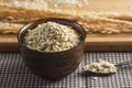 Dry oats in a wooden cup Royalty Free Stock Photo