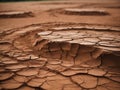 dry orange cracked clay, mud, desert. Natural background of cracked dry lands. Natural texture of soil with cracks. Broken clay Royalty Free Stock Photo