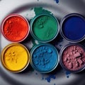 Dry paintings in jars. Red, yellow, green, blue, magenta eyeshadow, makeup grimm on table. Top view