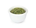 Dry parsley in ceramic bowl on background Royalty Free Stock Photo