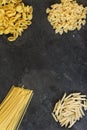 Dry pasta background. Different pasta on dark background. Flat l Royalty Free Stock Photo
