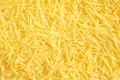 Dry pasta close-up. Culinary background, texture, pattern of yellow vermicelli. Copy space Royalty Free Stock Photo