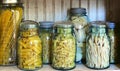 Dry Pasta stored in antique blue glass jars Royalty Free Stock Photo