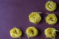 Dry pasta yellow on a dark background. Italian food