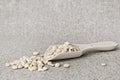 Dry peas in a wooden spoon on a canvas background - still life in rustic style Royalty Free Stock Photo