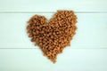 Dry pet food laid out in the shape of a heart Royalty Free Stock Photo