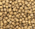 Dry pet food texture background. Food for cats and dogs pattern. Pile of granulated animal feeds. Granules of good nutrition for Royalty Free Stock Photo