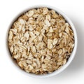 Dry porridge oats in white ceramic bowl. Royalty Free Stock Photo