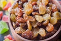 Dry raisins in a wooden bowl