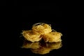 Dry, raw egg pasta capelli , isolated on black background. Cooking concept. Top view with copy space Royalty Free Stock Photo