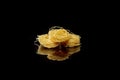 Dry, raw egg pasta capelli , isolated on black background. Cooking concept. Top view with copy space Royalty Free Stock Photo