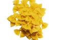 Dry raw uncooked farfalle pasta background. Flat lay Royalty Free Stock Photo