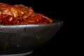 Dry red cherry tomato isolated on black glass Royalty Free Stock Photo