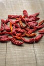 Dry red chillies in a wooden background Royalty Free Stock Photo