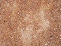 Dry red clay with stones textured background Royalty Free Stock Photo