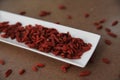 Dry red goji berries on a plate Royalty Free Stock Photo