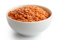 Dry red lentils in white ceramic bowl. Royalty Free Stock Photo