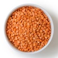 Dry red lentils in white ceramic bowl. Royalty Free Stock Photo