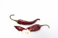 Dry red pepper pod with seeds on a white background. Broken dry pod in half Royalty Free Stock Photo