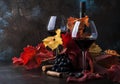 Dry Red Wine in big wine glass, autumn still life with leaves, wine tasting concept, rustic style, selective focus Royalty Free Stock Photo