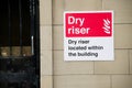 Dry riser located within the building sign Royalty Free Stock Photo
