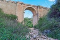 A dry river bed in the foreground, with a bridge passing overhead - the concept of Climate Change Royalty Free Stock Photo