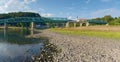 Dry riverbed of river Elbe in Decin, Czech Republic. Castle above old railway bridge Royalty Free Stock Photo