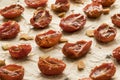 Dry roasted mini tomatoes on baking paper close up