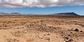 Dry and rocky desert landscape w Royalty Free Stock Photo