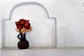 Dry roses in a ceramic vase