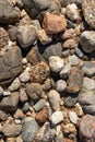 Dry round stones on beach background Royalty Free Stock Photo
