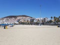Dry sandy beach view in Playa de las Americas Tenerife with apartments in the distance