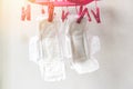 Dry sanitary napkin or feminine sanitary pad in the sun cleaning and dried hang on clothespin concept - Female hygiene means women