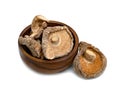 Dry shiitake mushrooms in wooden bowl isolated on white background Royalty Free Stock Photo