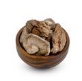 Dry shiitake mushrooms in wooden bowl isolated on white background ,include clipping path Royalty Free Stock Photo