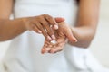 Dry Skin Remedies. Unrecognizable African American Female Applying Moisturizing Cream On Hands Royalty Free Stock Photo