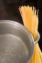 Dry spaghetti with boiling water in a pan Royalty Free Stock Photo