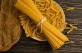 Dry spaghetti cuisine various wooden background ingredient, uncooked