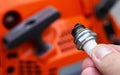 Dry spark plug in a chainsaw. Lean mixture of fuel. Malfunction in the ignition system.