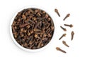 dry spice cloves in ceramic bowl isolated on white background. Top view. Flat lay Royalty Free Stock Photo
